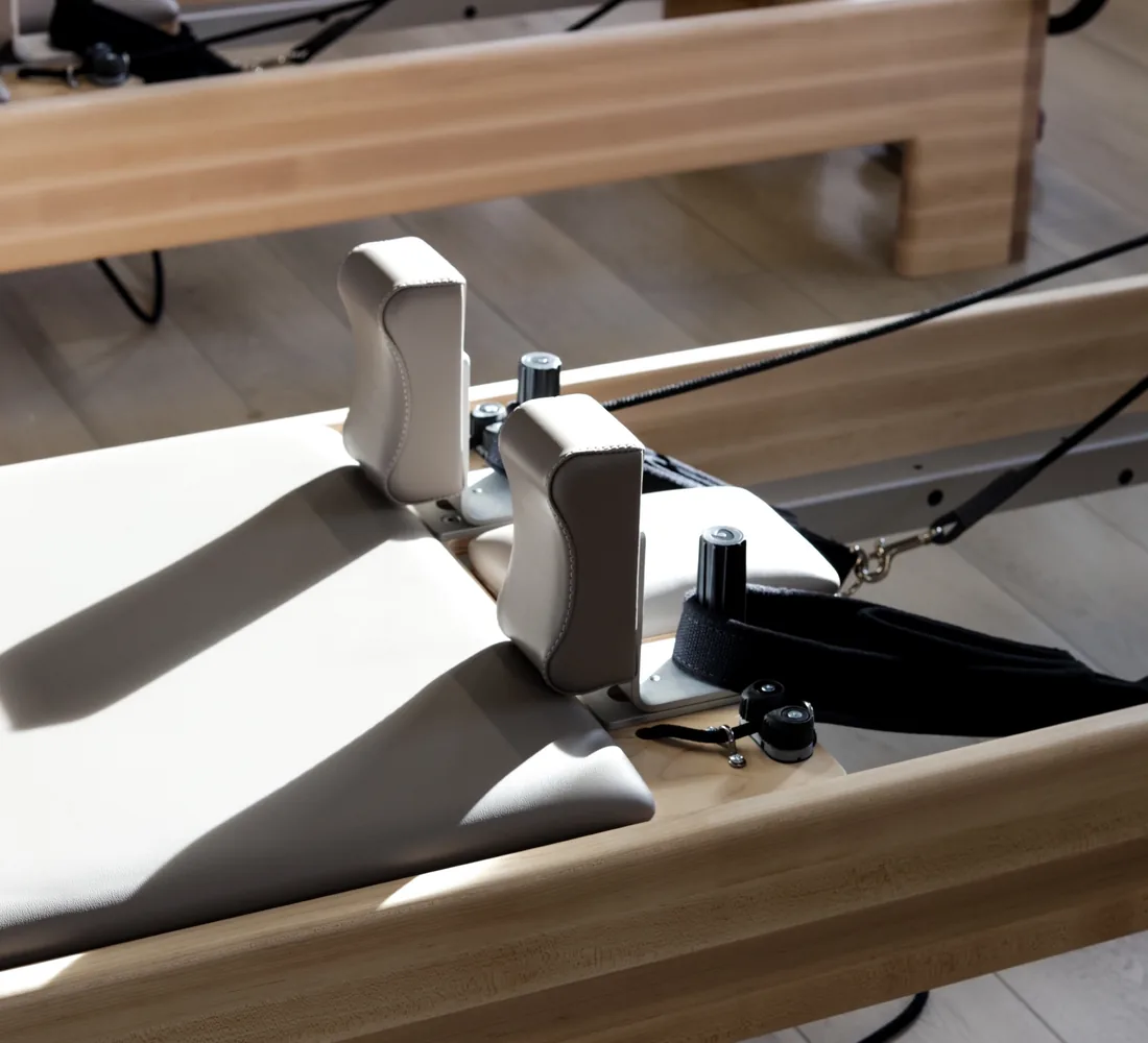 Close-up of a Balanced Body reformer carriage at Stellar Pilates