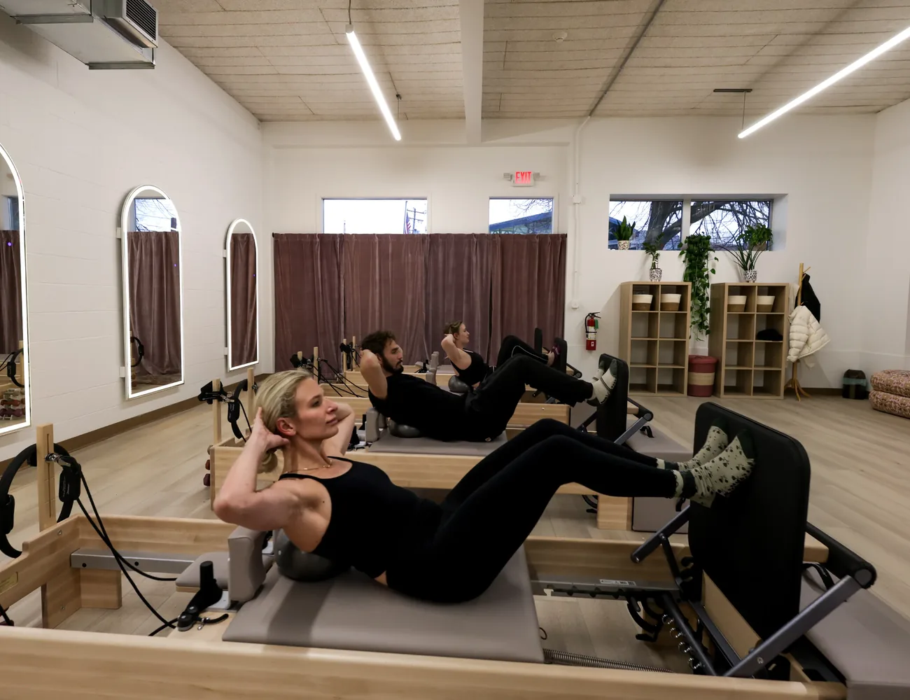 Group reformer class in session at Stellar Pilates